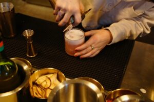 Jessica Rodrigues making cocktails at the Beatrice Society Cafe